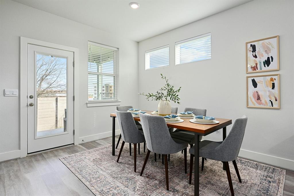 7318 Harmony Shoals Bend, Unit 182 Austin, TX 78744 - Photo 12 of 27 a dining room with furniture and window