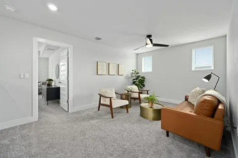 a living room with furniture and a window