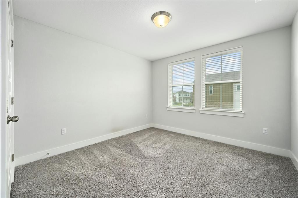 7318 Harmony Shoals Bend, Unit 182 Austin, TX 78744 - Photo 21 of 27 an empty room with a window