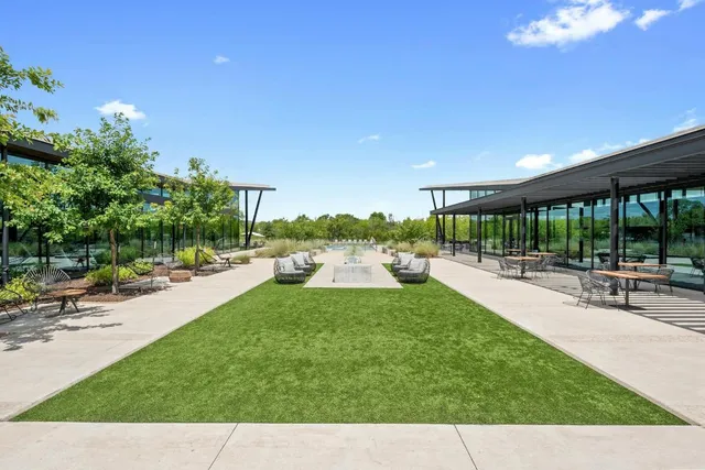 a view of a patio with a dining table and chairs with a patio