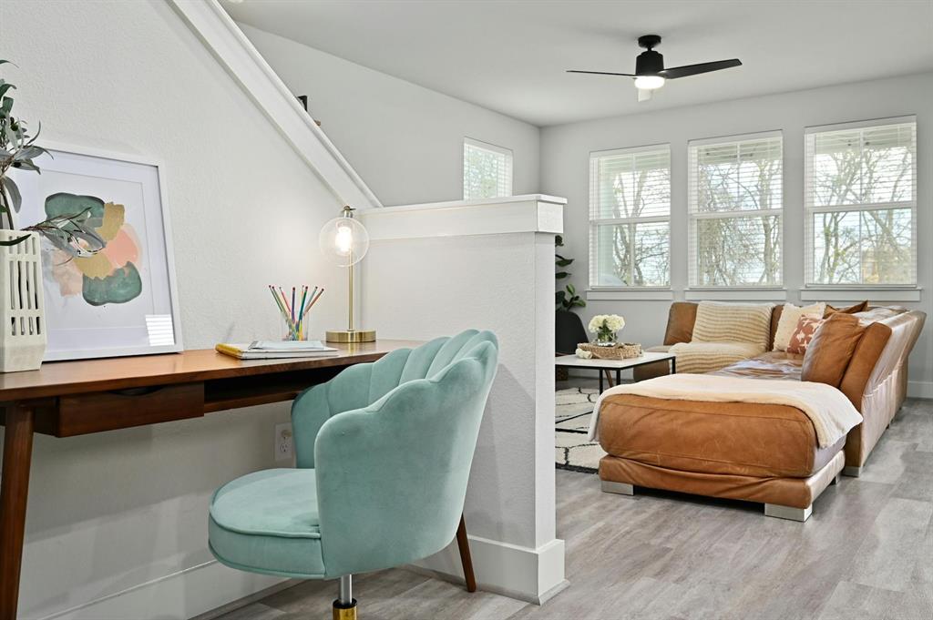 7318 Harmony Shoals Bend, Unit 182 Austin, TX 78744 - Photo 9 of 27 a living room with furniture and a large window