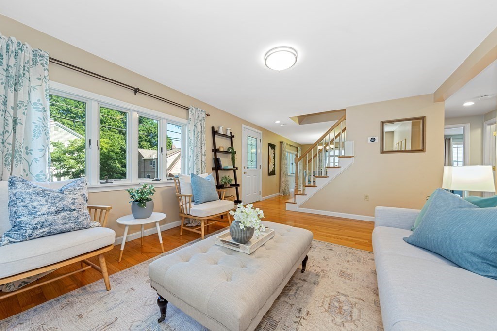 24 Fountain Road Arlington, MA 02476 - Photo 11 of 42 a living room with furniture and a large window