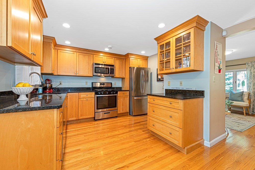 24 Fountain Road Arlington, MA 02476 - Photo 19 of 42 a kitchen with stainless steel appliances granite countertop a stove a sink and a refrigerator