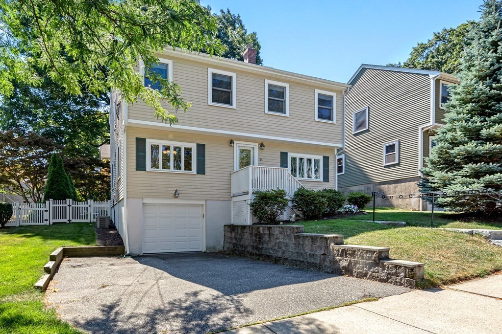 24 Fountain Road Arlington, MA 02476 - Photo 2 of 42 a front view of a house with a yard