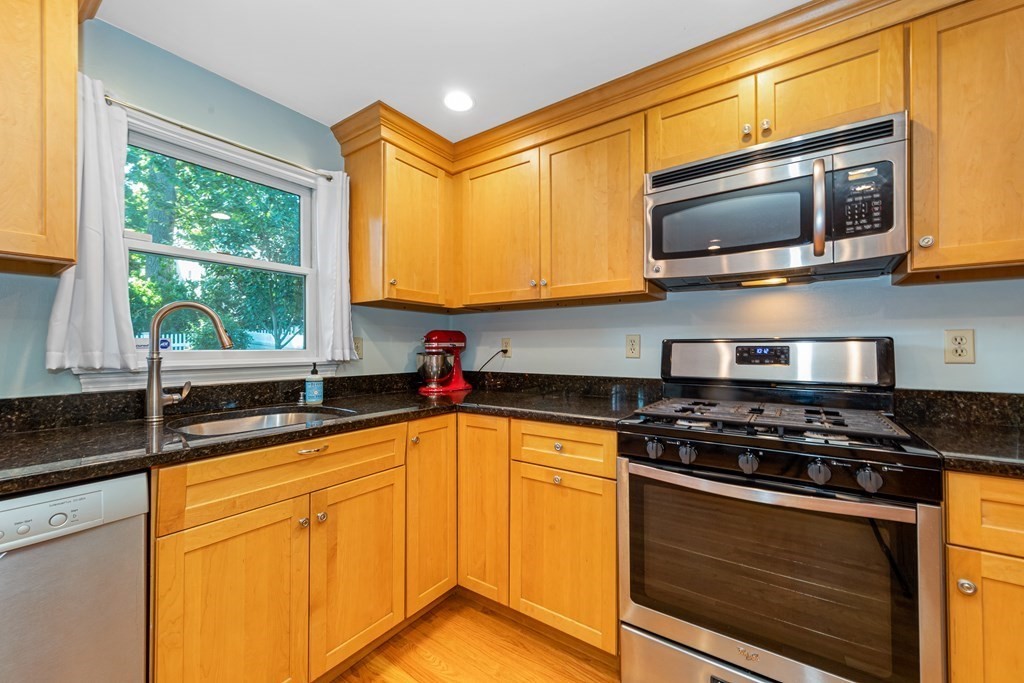 24 Fountain Road Arlington, MA 02476 - Photo 23 of 42 a kitchen with stainless steel appliances granite countertop a sink and a stove