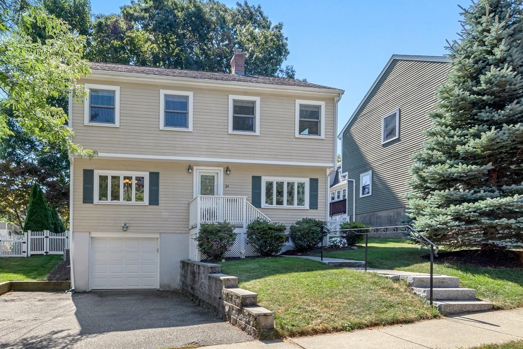 24 Fountain Road Arlington, MA 02476 - Photo 3 of 42 a front view of a house with garden