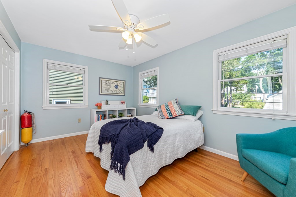 24 Fountain Road Arlington, MA 02476 - Photo 32 of 42 a bedroom with a bed and wooden floor