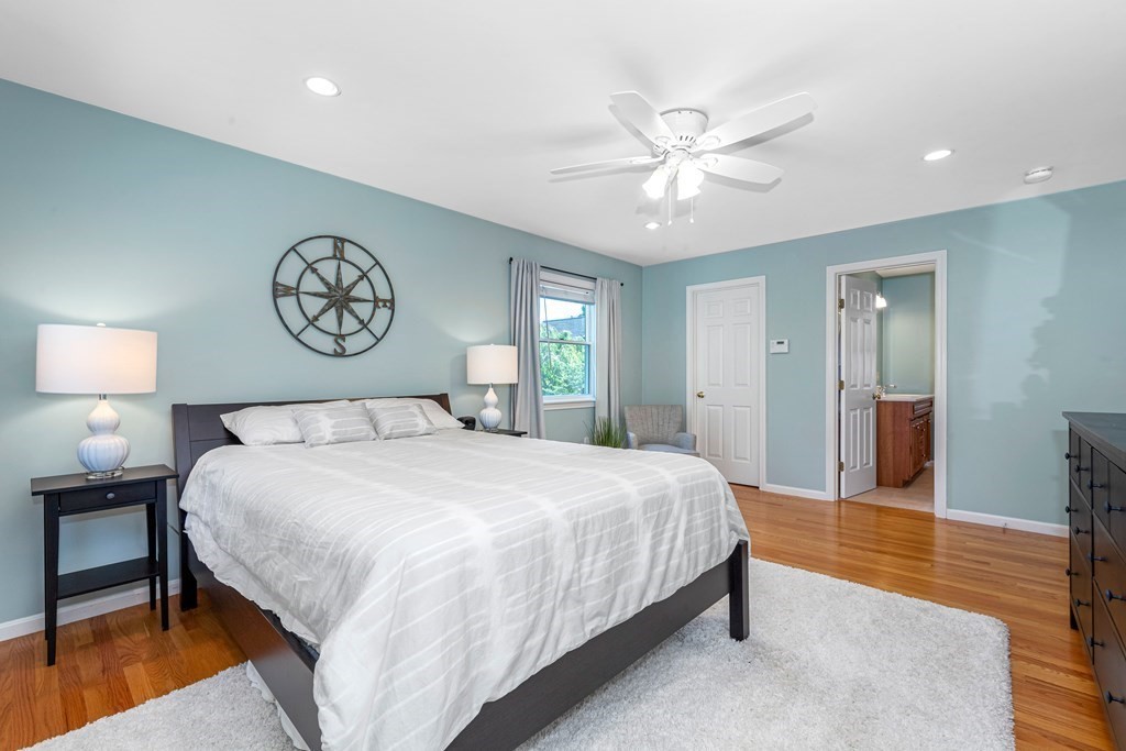 24 Fountain Road Arlington, MA 02476 - Photo 35 of 42 a bedroom with a large bed and a chandelier
