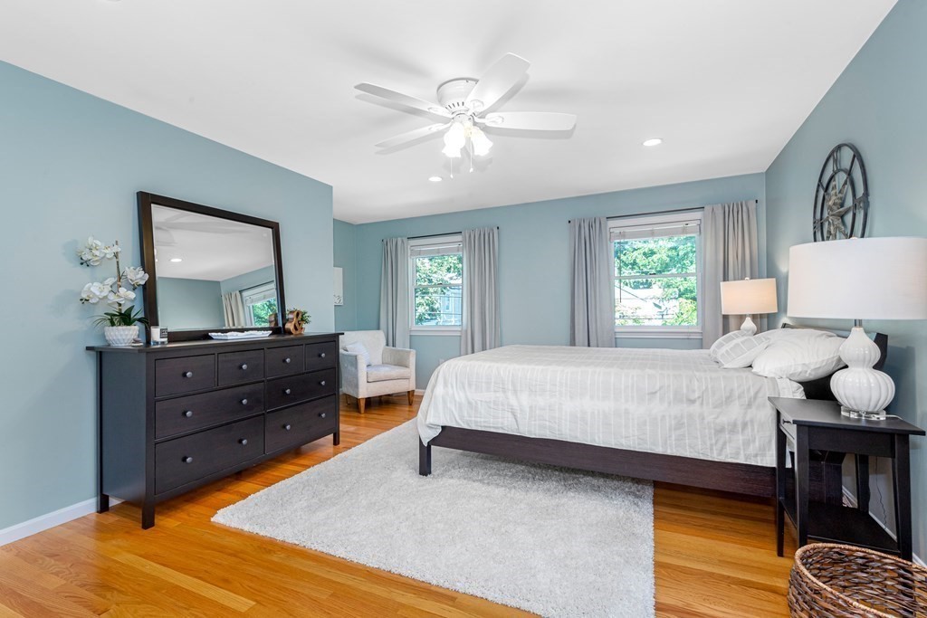 24 Fountain Road Arlington, MA 02476 - Photo 36 of 42 a bedroom with a bed and wooden floor