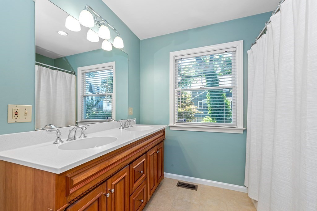 24 Fountain Road Arlington, MA 02476 - Photo 38 of 42 a bathroom with a sink and a mirror