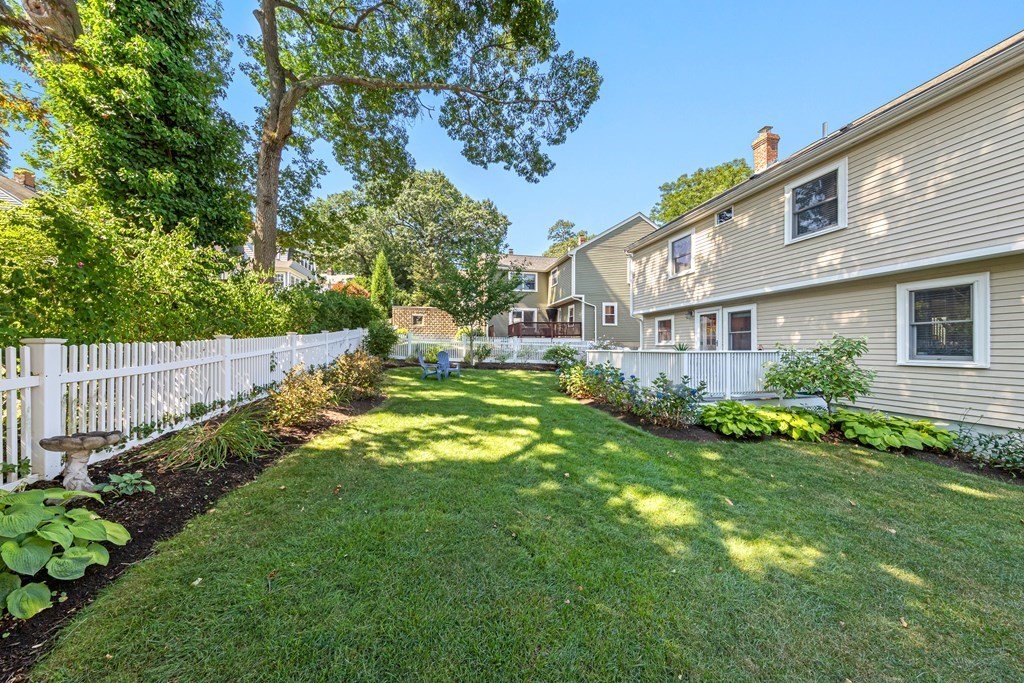 24 Fountain Road Arlington, MA 02476 - Photo 7 of 42 a backyard of a house with lots of green space