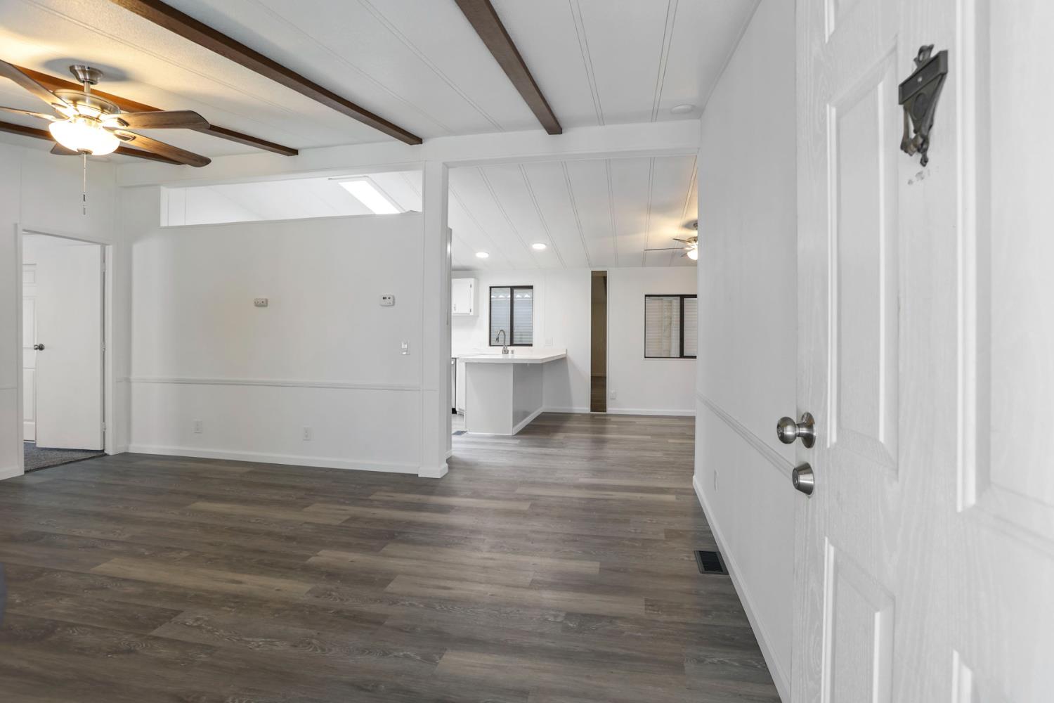 2124 Key W Lane Modesto, CA 95350 - Photo 11 of 30 a view of a hallway with wooden floor