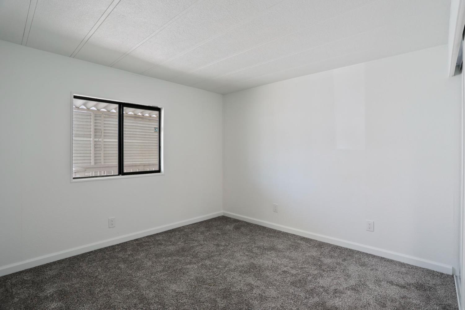 2124 Key W Lane Modesto, CA 95350 - Photo 21 of 30 an empty room with a window