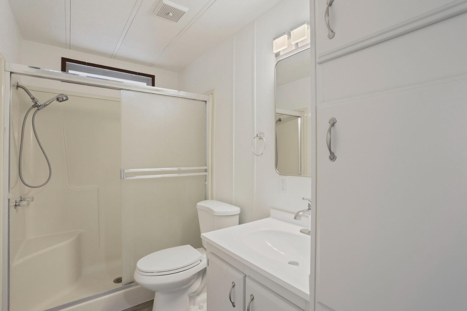 2124 Key W Lane Modesto, CA 95350 - Photo 22 of 30 a bathroom with a sink a toilet and shower