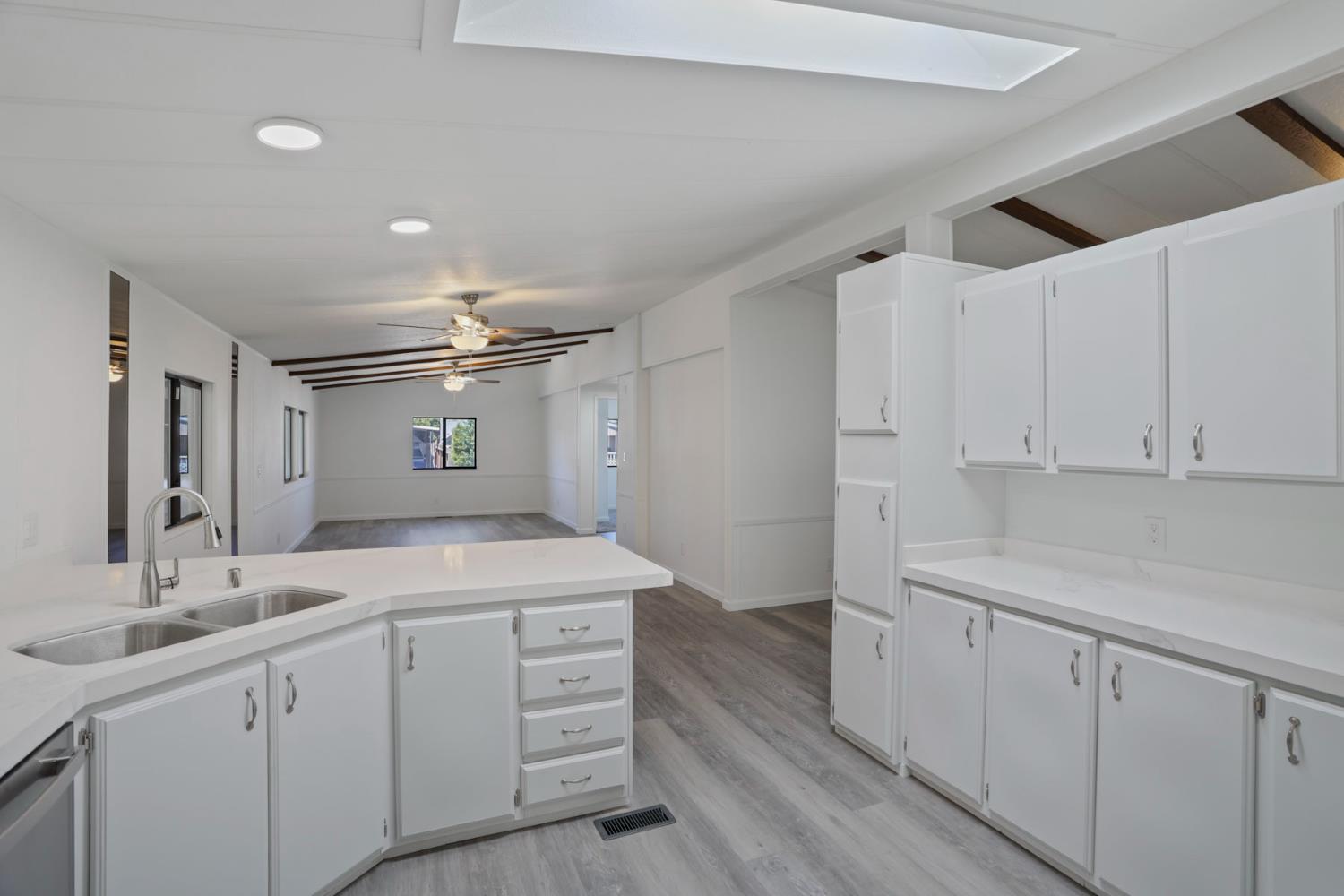 2124 Key W Lane Modesto, CA 95350 - Photo 4 of 30 a bathroom with a sink a vanity and mirror