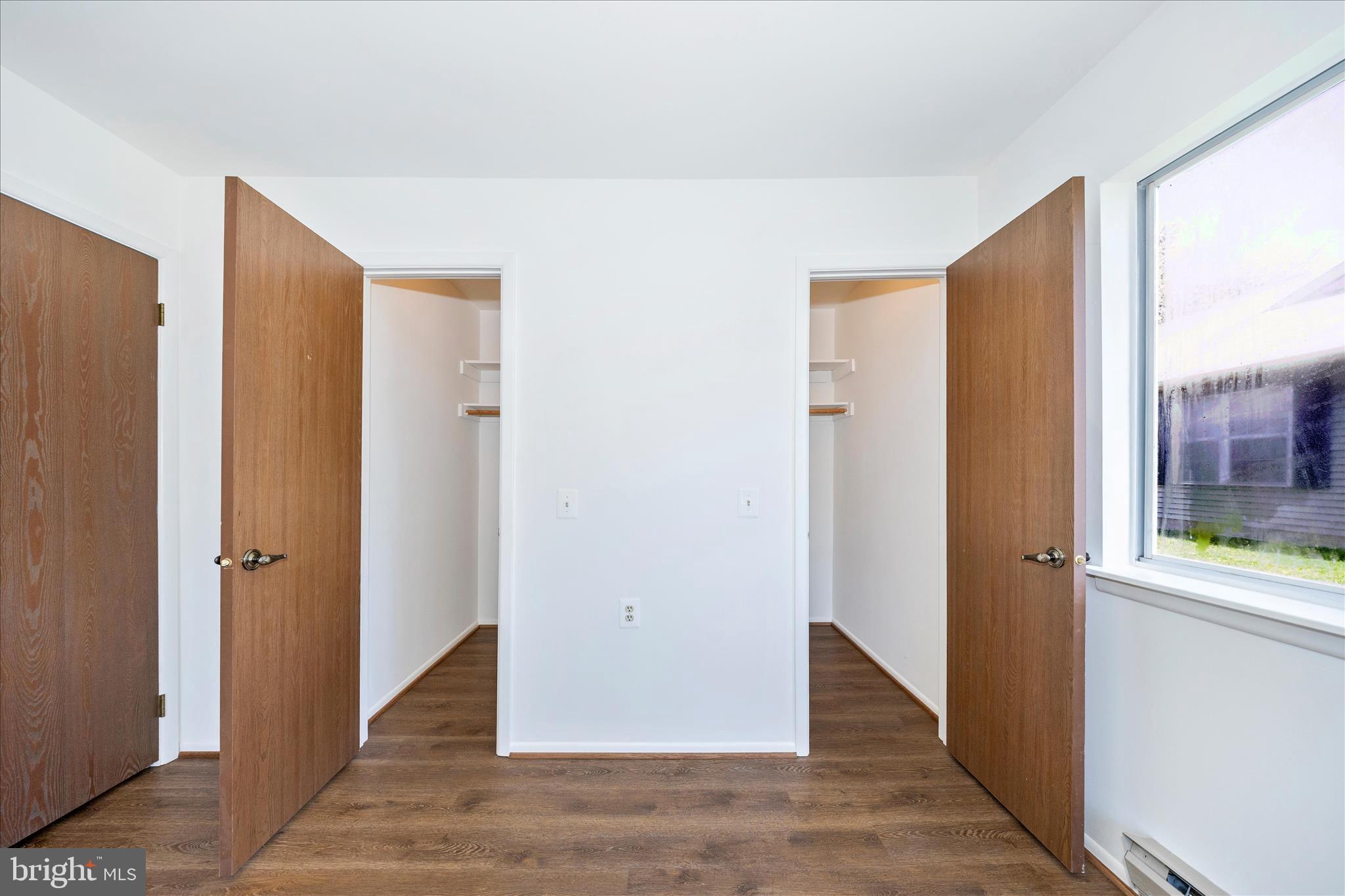 5738 Box Elder Court Frederick, MD 21703 - Photo 22 of 50 a view of a hallway with wooden floor and windows