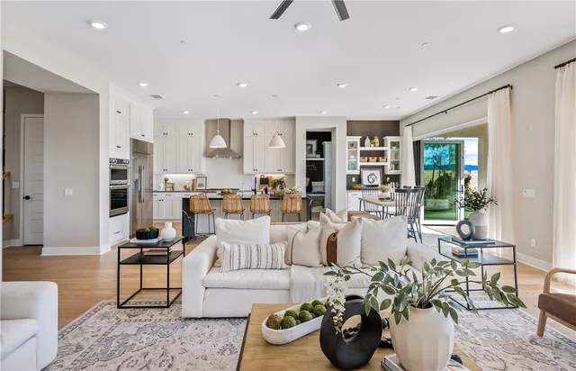 a living room with furniture a window and a rug