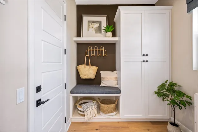 a kitchen with granite countertop a sink a stove and cabinets