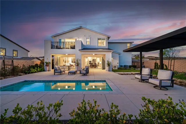 a front view of a house with swimming pool