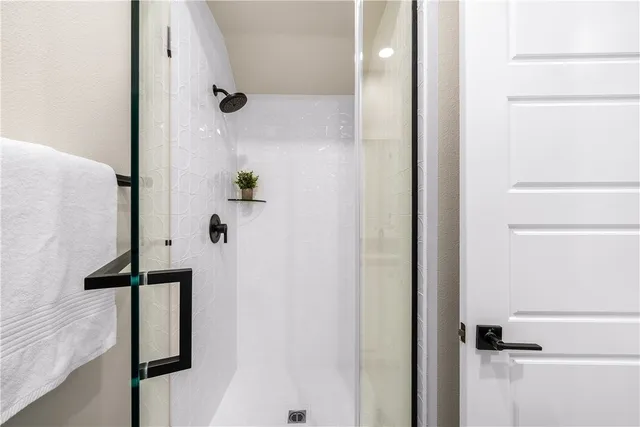 a kitchen with stainless steel appliances granite countertop a refrigerator and a stove