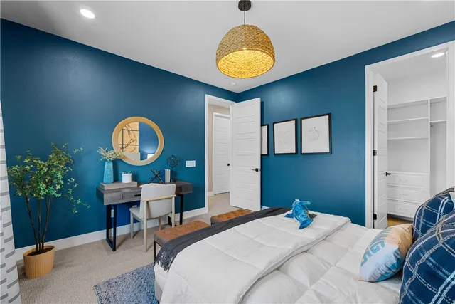 a view of a patio with a table and chairs under an umbrella