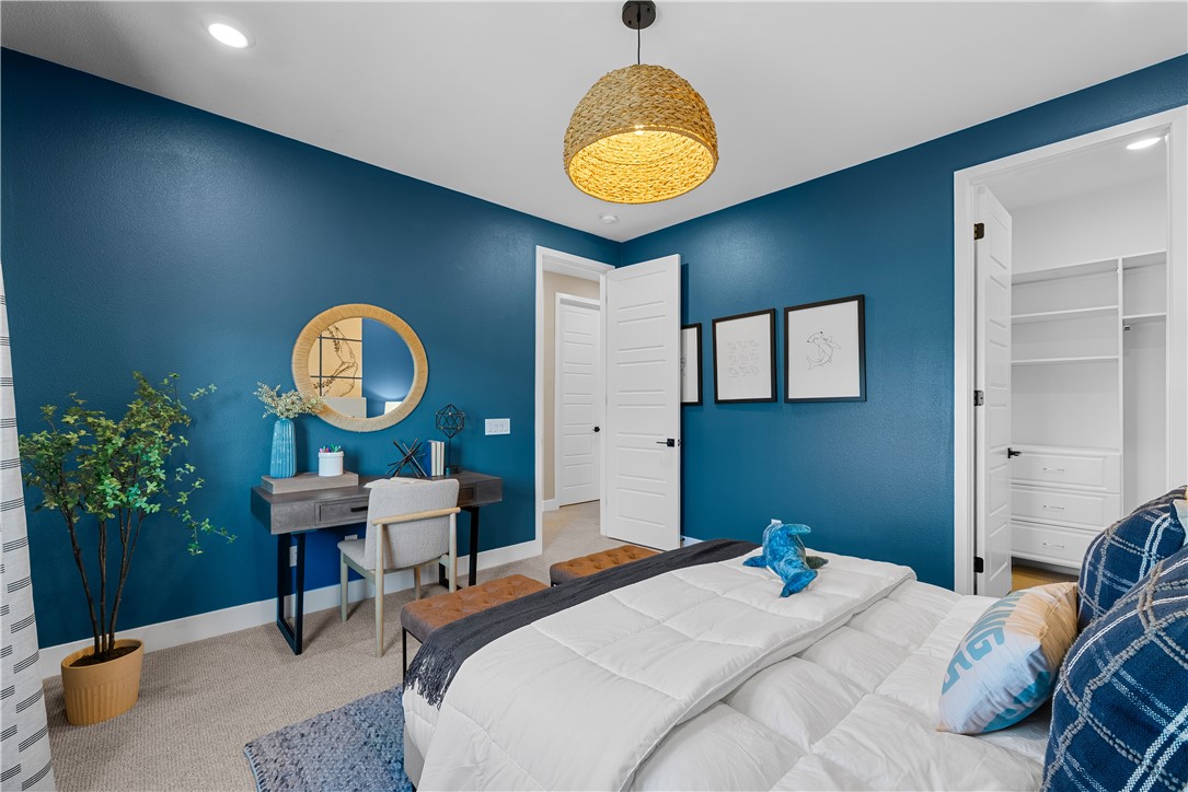 28414 Old Spgs Road Castaic, CA 91384 - Photo 27 of 62 a bedroom with bed and a chandelier