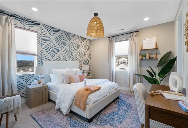 a view of a dining room with a table and chairs