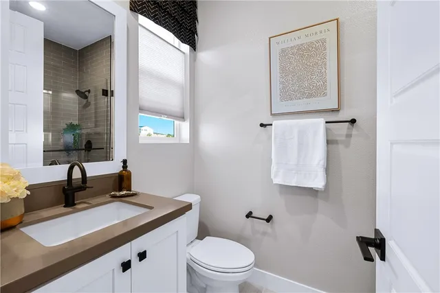 a view of a patio with a table and chairs under an umbrella