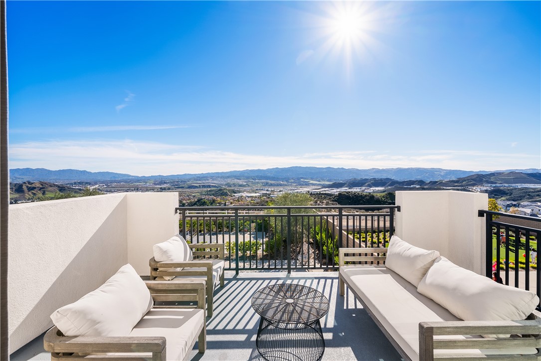 28414 Old Spgs Road Castaic, CA 91384 - Photo 34 of 62 a view of a balcony with wooden floor and iron stairs