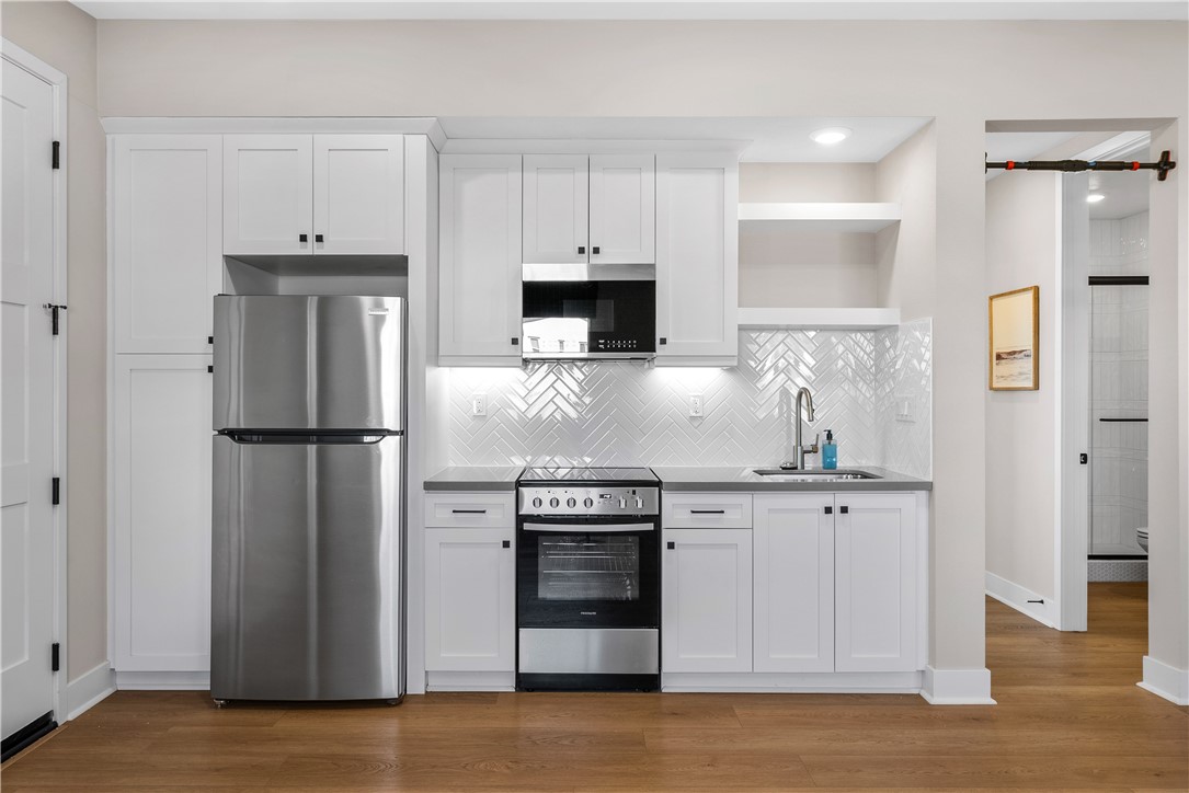 28414 Old Spgs Road Castaic, CA 91384 - Photo 41 of 62 a kitchen with stainless steel appliances granite countertop a refrigerator and a stove