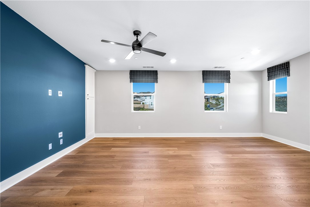28414 Old Spgs Road Castaic, CA 91384 - Photo 43 of 62 a view of an empty room with window and wooden floor