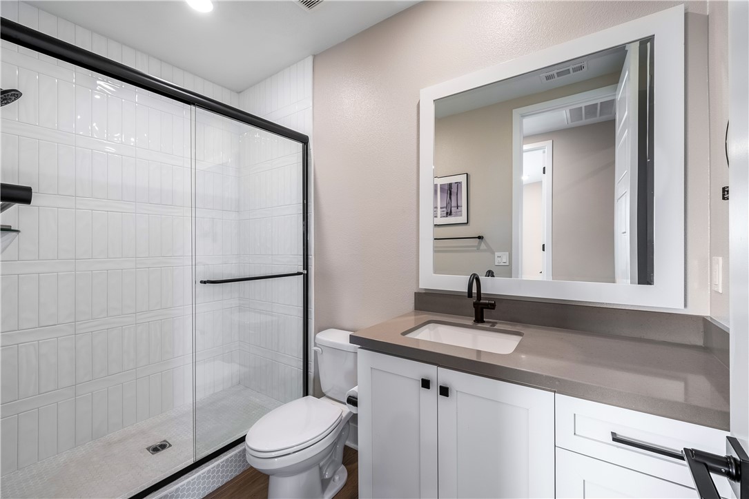 28414 Old Spgs Road Castaic, CA 91384 - Photo 45 of 62 a bathroom with a sink a toilet and shower