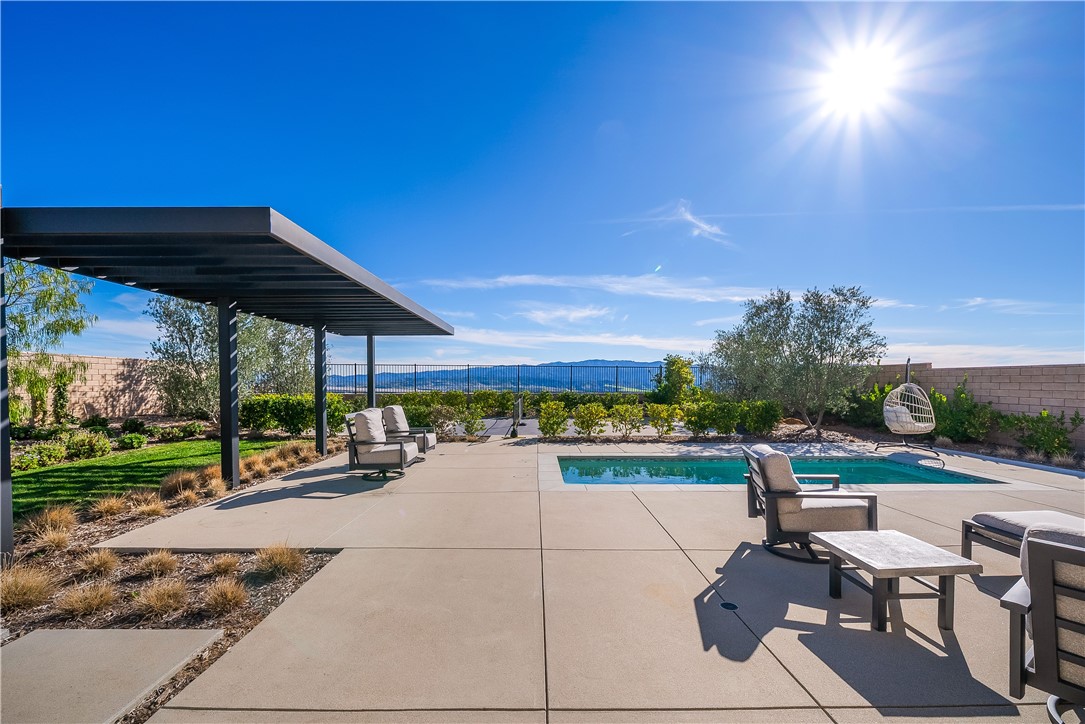 28414 Old Spgs Road Castaic, CA 91384 - Photo 52 of 62 a view of a patio with a table and chairs under an umbrella