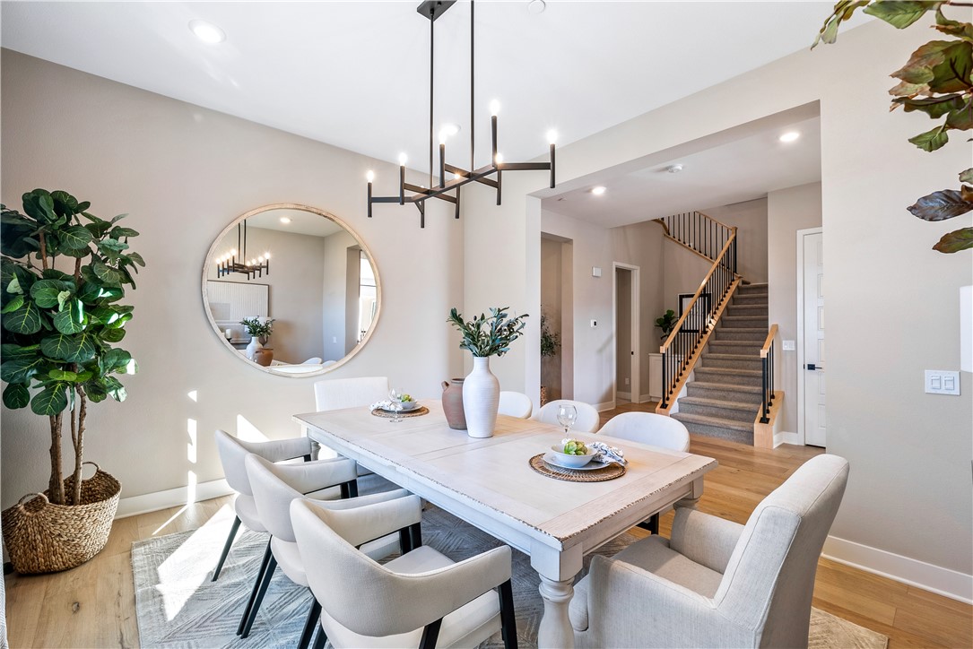 28414 Old Spgs Road Castaic, CA 91384 - Photo 7 of 62 a view of a dining room with furniture and wooden floor