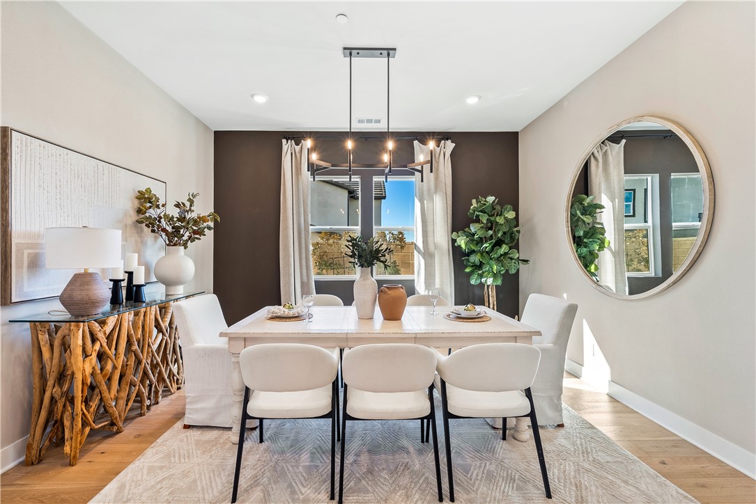 28414 Old Spgs Road Castaic, CA 91384 - Photo 8 of 62 a dining room with furniture potted plants and wooden floor