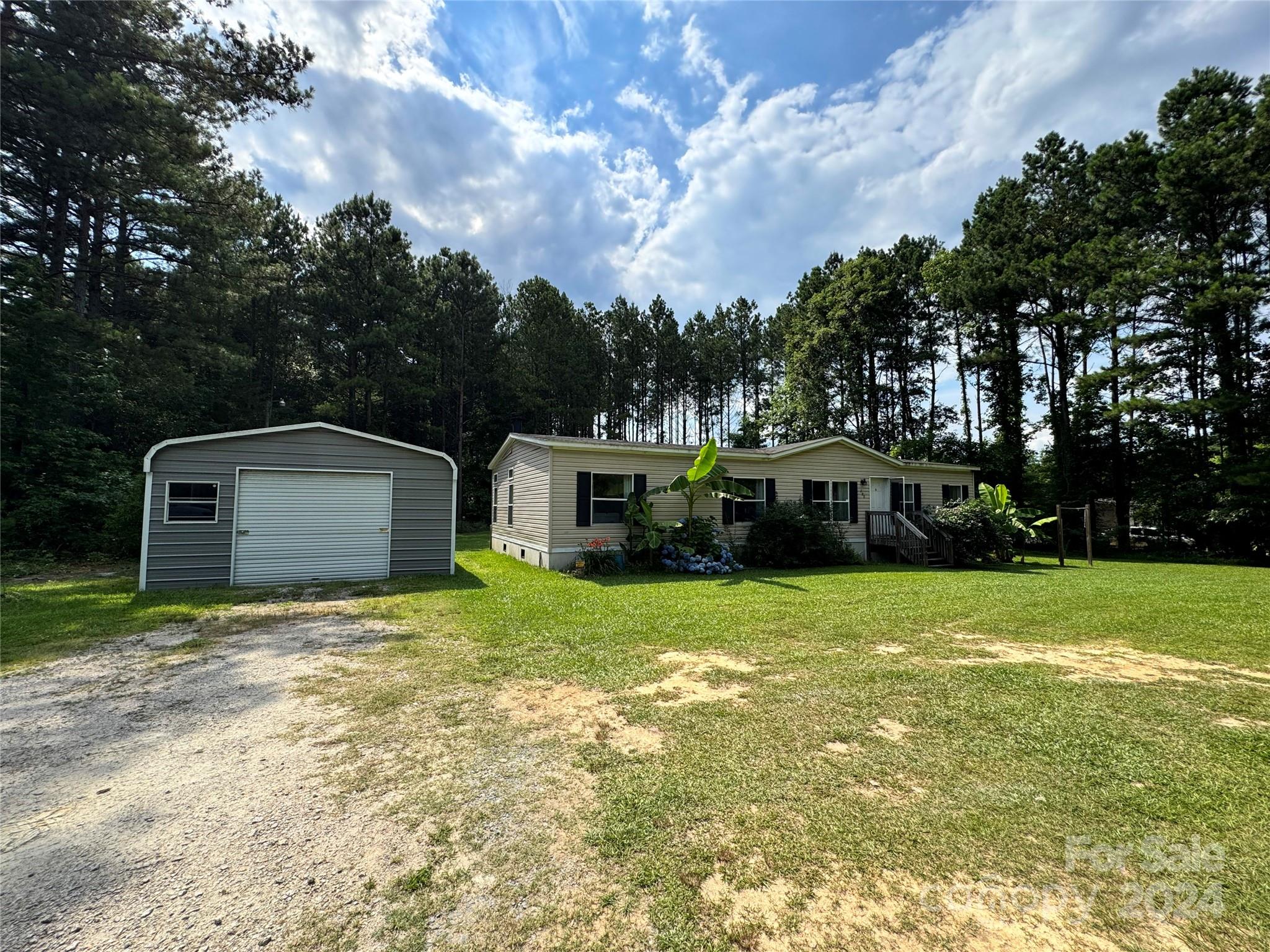 790 Langley Road Lancaster, SC 29720 - Photo 2 of 36 a house view with a garden space