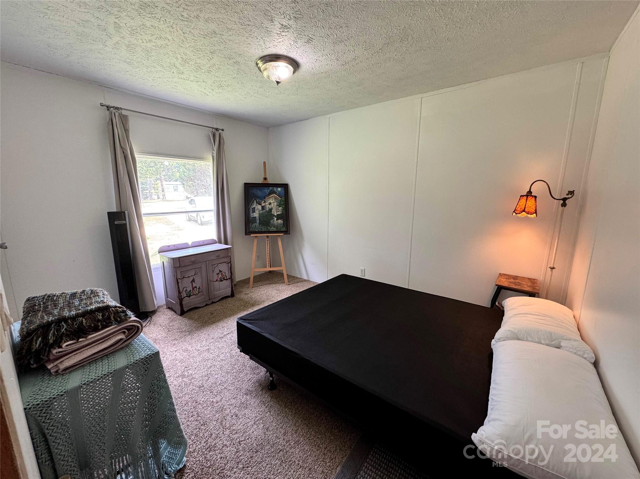 790 Langley Road Lancaster, SC 29720 - Photo 22 of 36 a bedroom with a bed and window