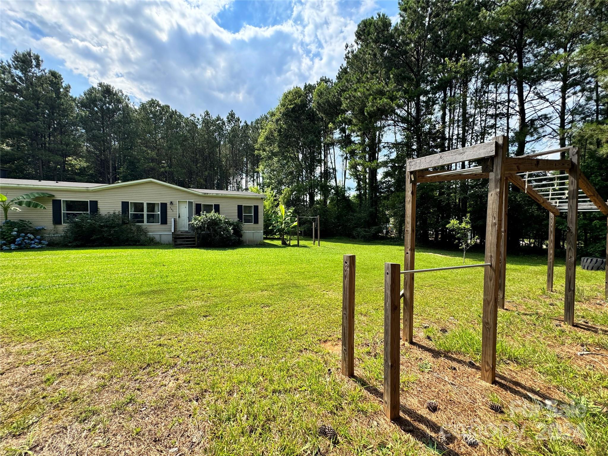 790 Langley Road Lancaster, SC 29720 - Photo 29 of 36 a view of house with a swimming pool