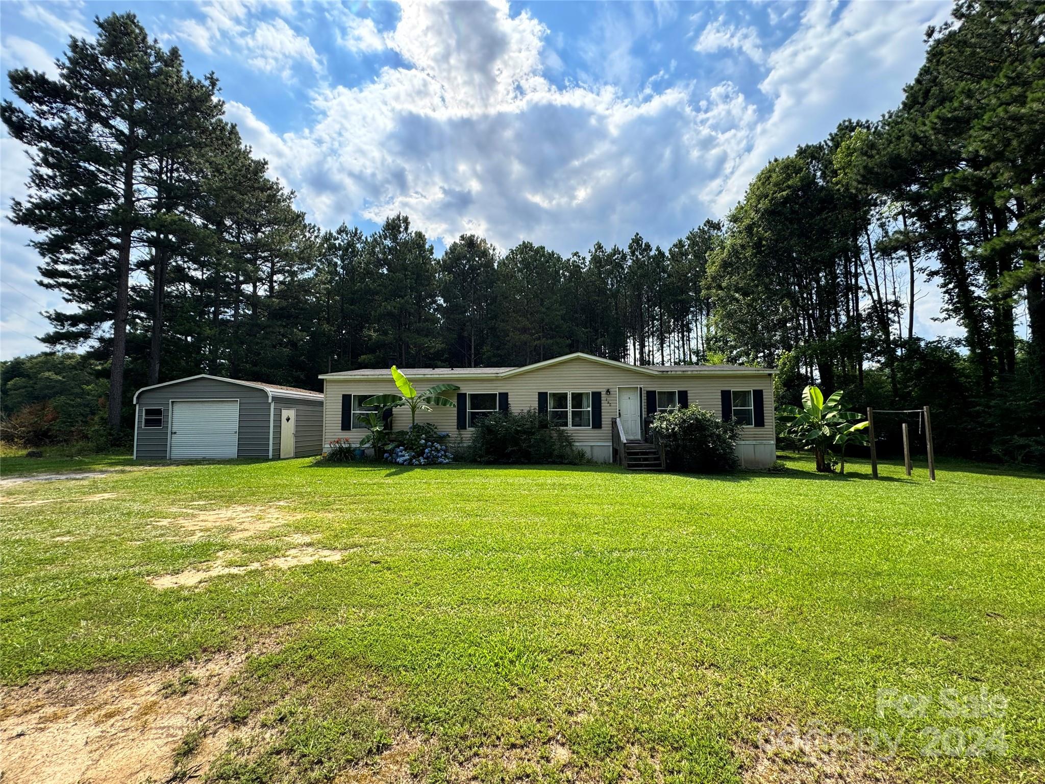 790 Langley Road Lancaster, SC 29720 - Photo 30 of 36 a front view of a house with garden