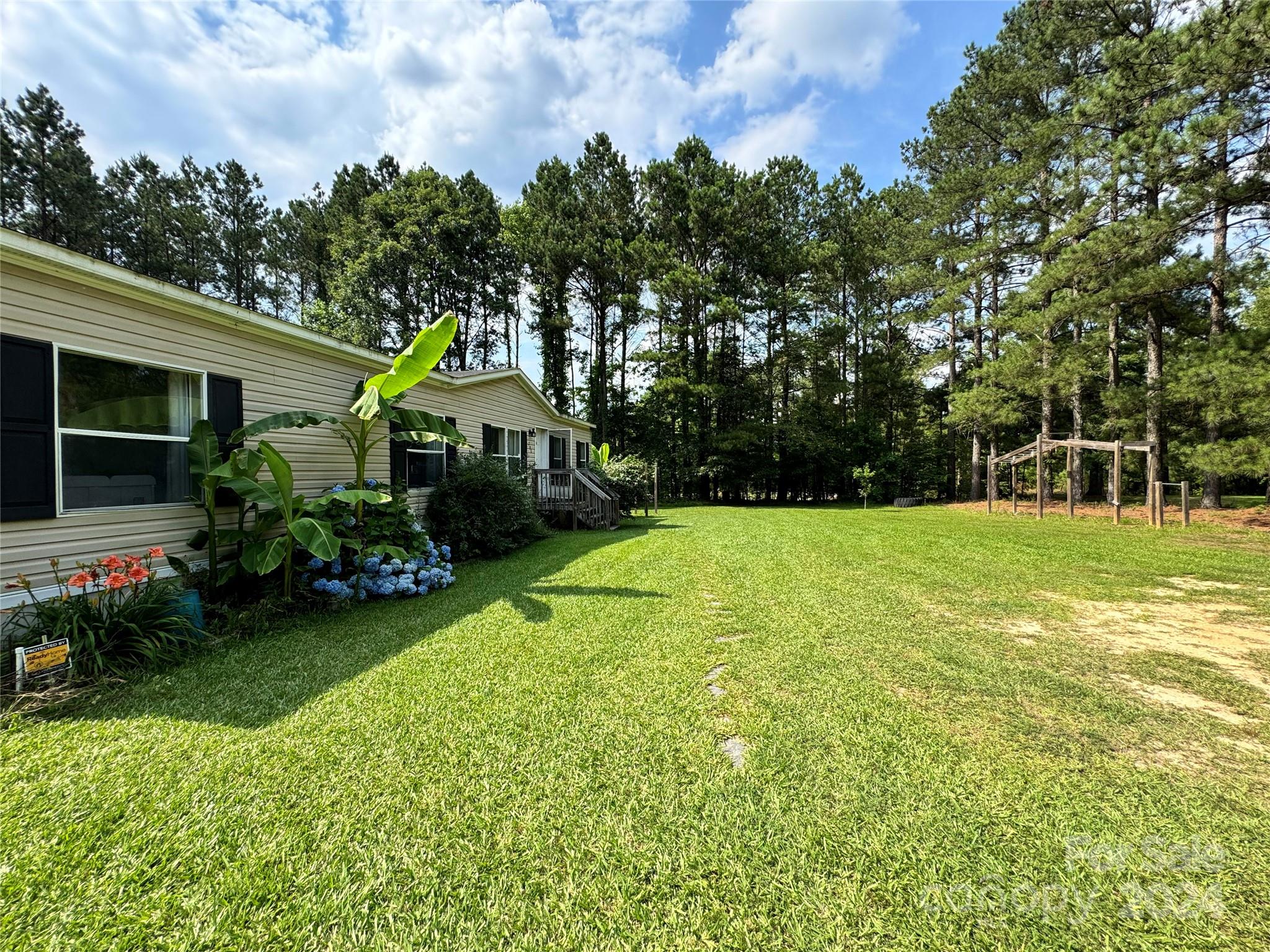 790 Langley Road Lancaster, SC 29720 - Photo 31 of 36 a front view of a house with garden