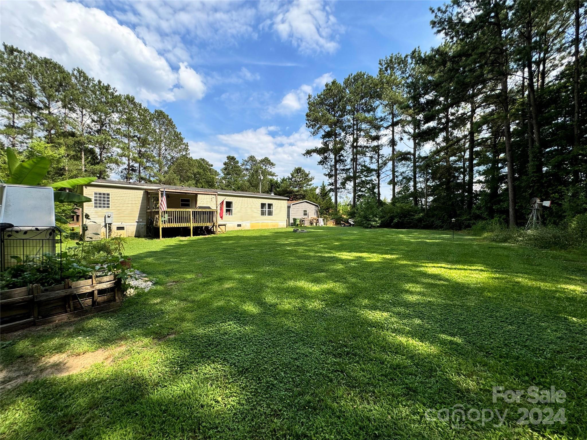 790 Langley Road Lancaster, SC 29720 - Photo 33 of 36 a backyard of a house with lots of green space