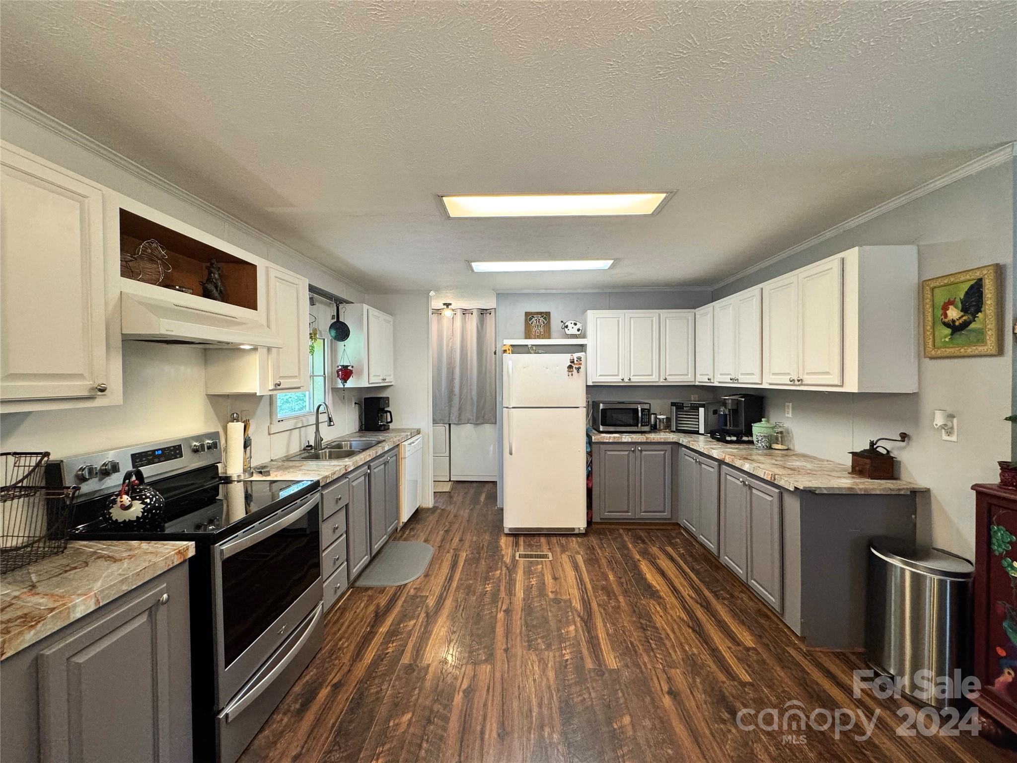 790 Langley Road Lancaster, SC 29720 - Photo 6 of 36 a large kitchen with stainless steel appliances a stove a sink dishwasher and a refrigerator