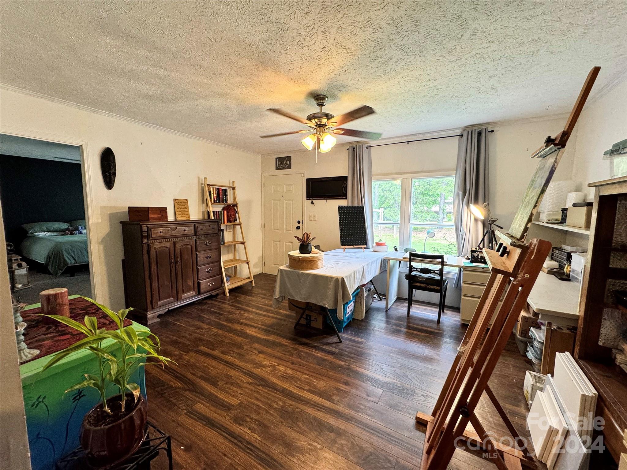 790 Langley Road Lancaster, SC 29720 - Photo 8 of 36 a living room with furniture a fireplace a flat screen tv and a large window