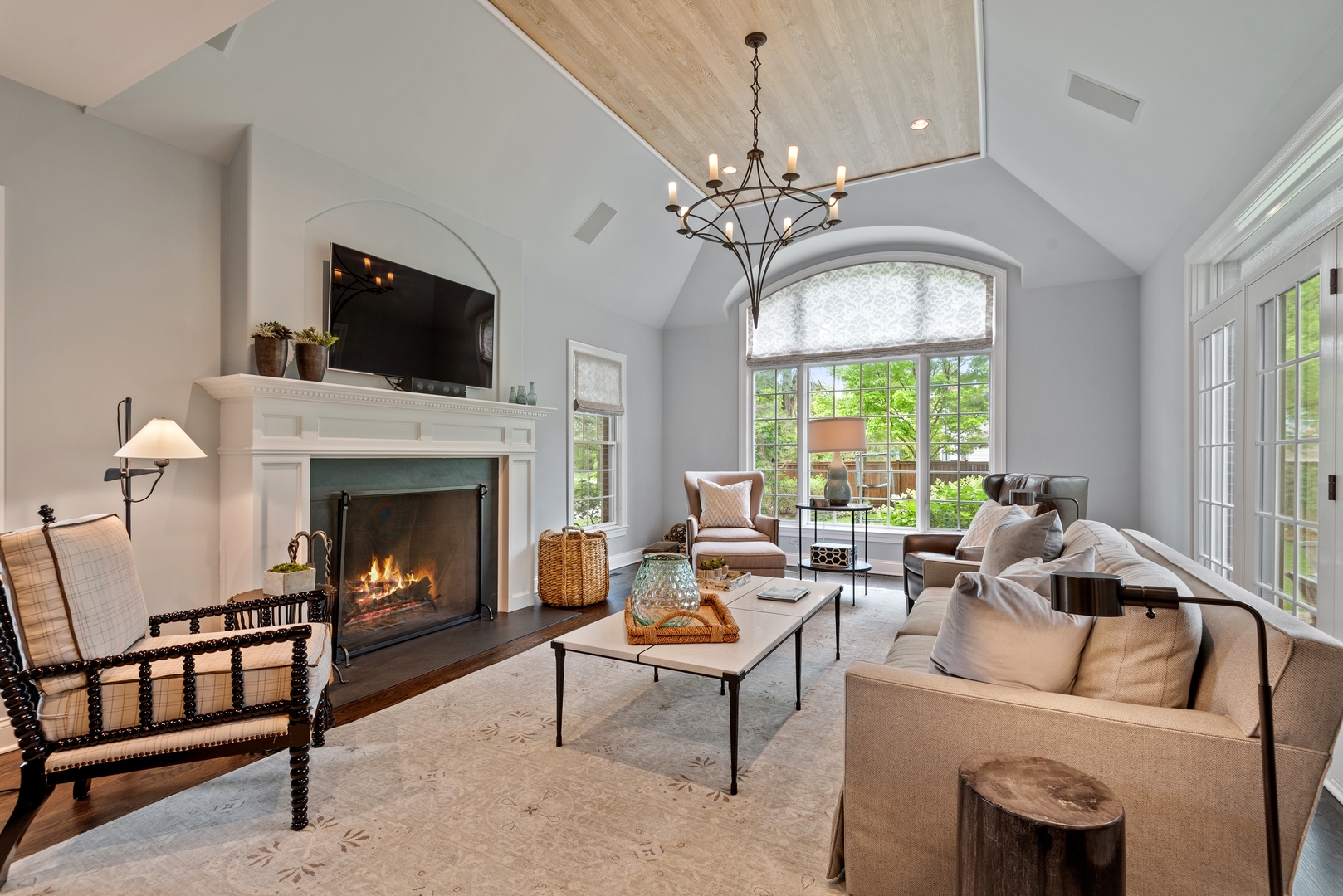 700 Harvard Street Wilmette, IL 60091 - Photo 16 of 50 a living room with furniture a chandelier and a fireplace