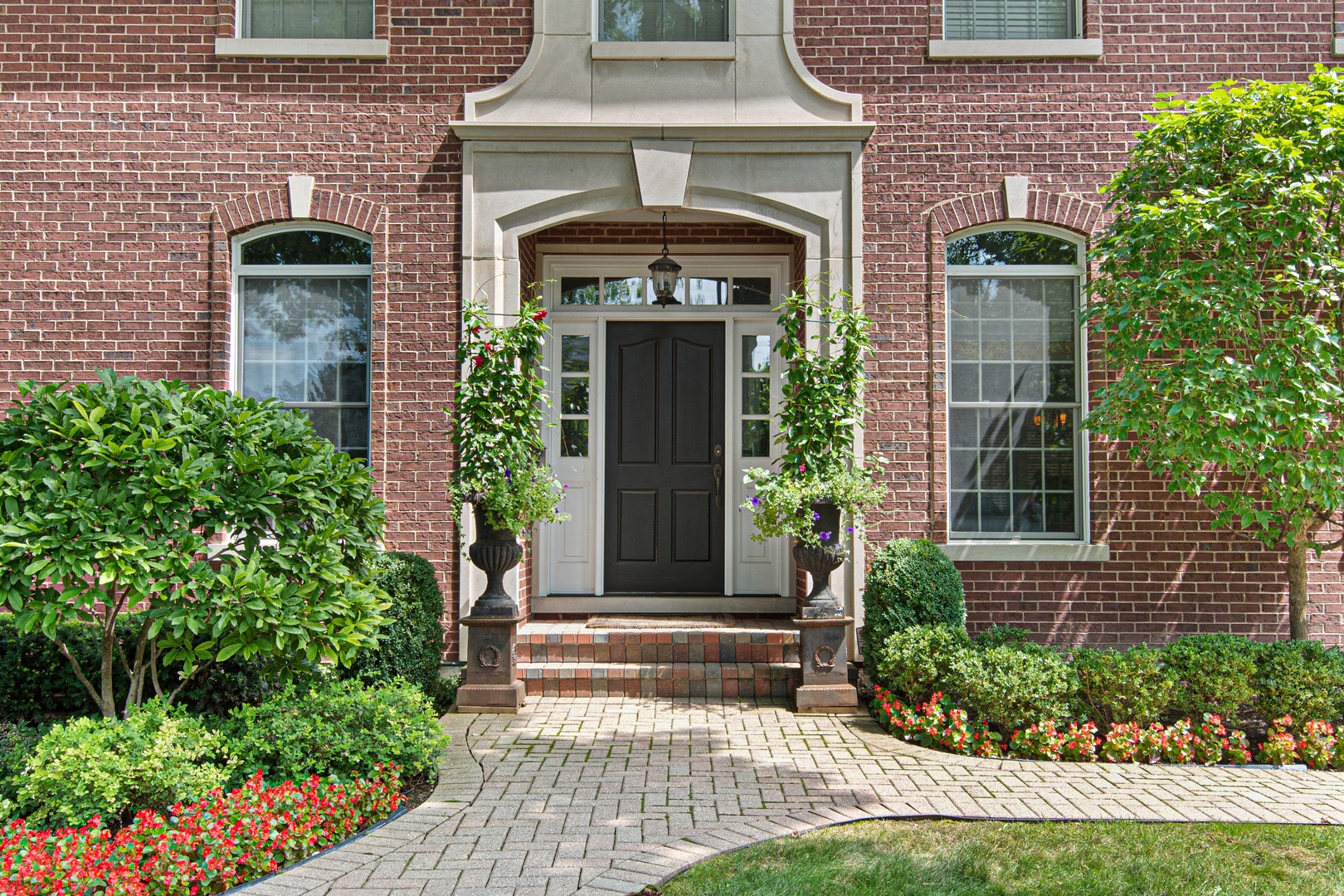 700 Harvard Street Wilmette, IL 60091 - Photo 2 of 50 a front view of a house with plants