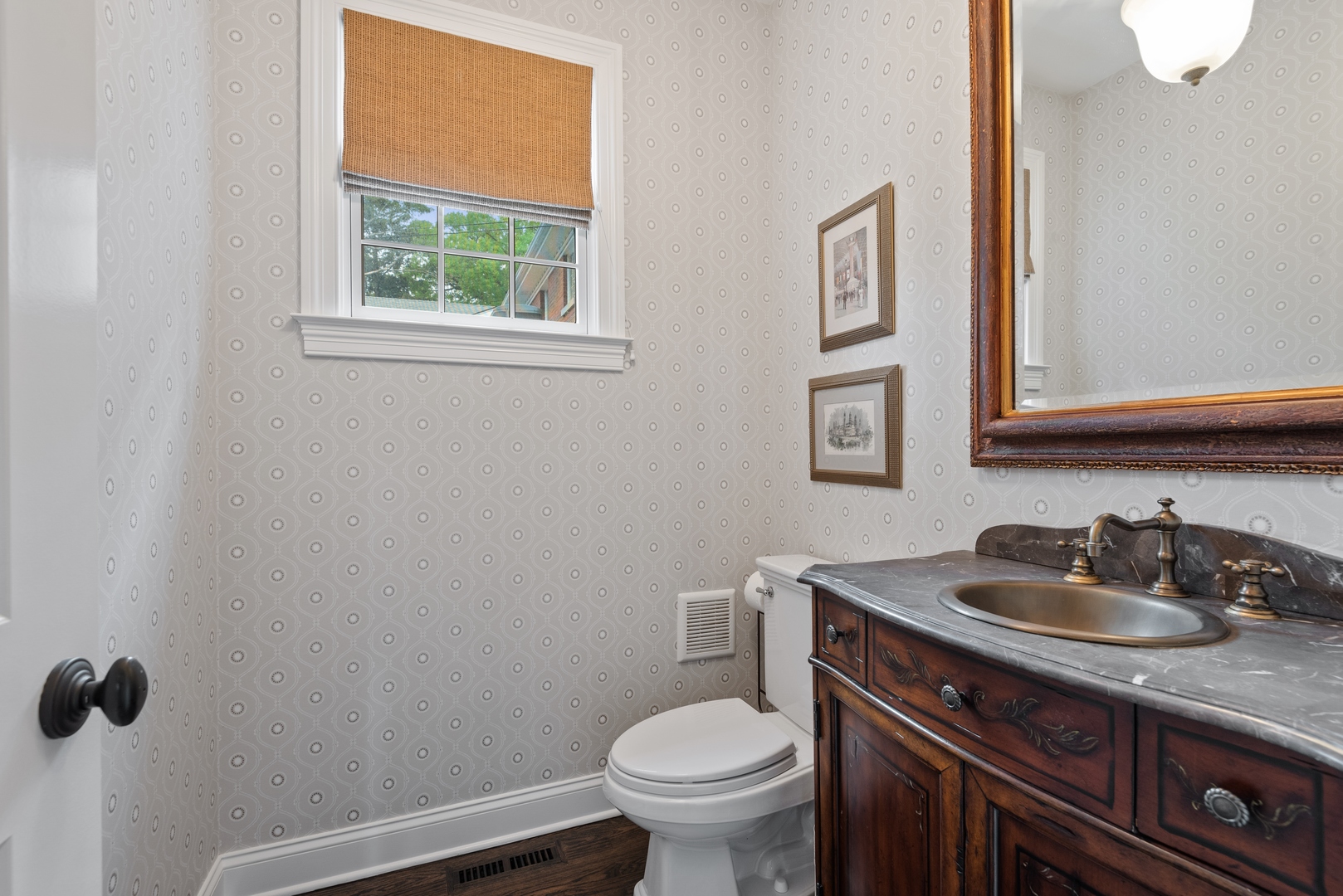 700 Harvard Street Wilmette, IL 60091 - Photo 21 of 50 a bathroom with a toilet sink and mirror