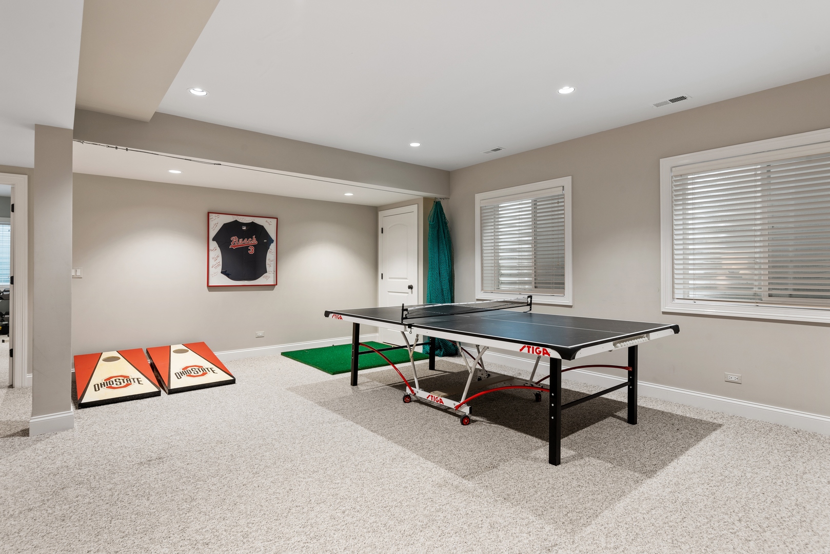 700 Harvard Street Wilmette, IL 60091 - Photo 36 of 50 a living room with furniture a flat screen tv and a table