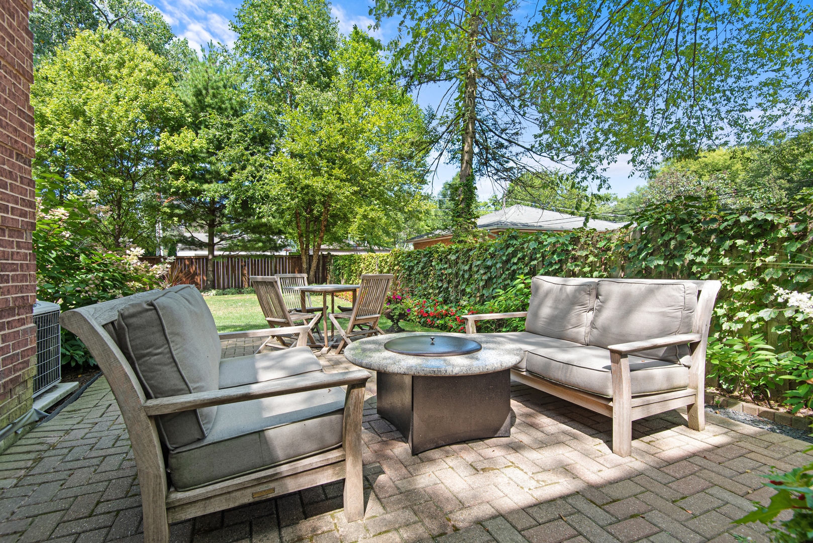 700 Harvard Street Wilmette, IL 60091 - Photo 44 of 50 a view of a patio with a chairs and table in a patio