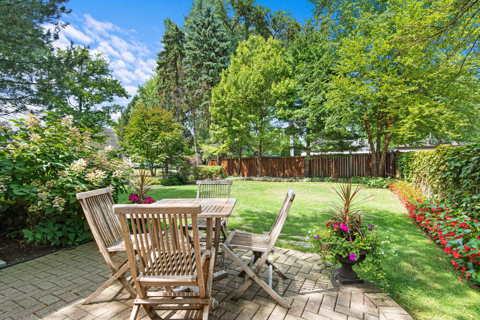 700 Harvard Street Wilmette, IL 60091 - Photo 45 of 50 a view of a chairs and table in backyard