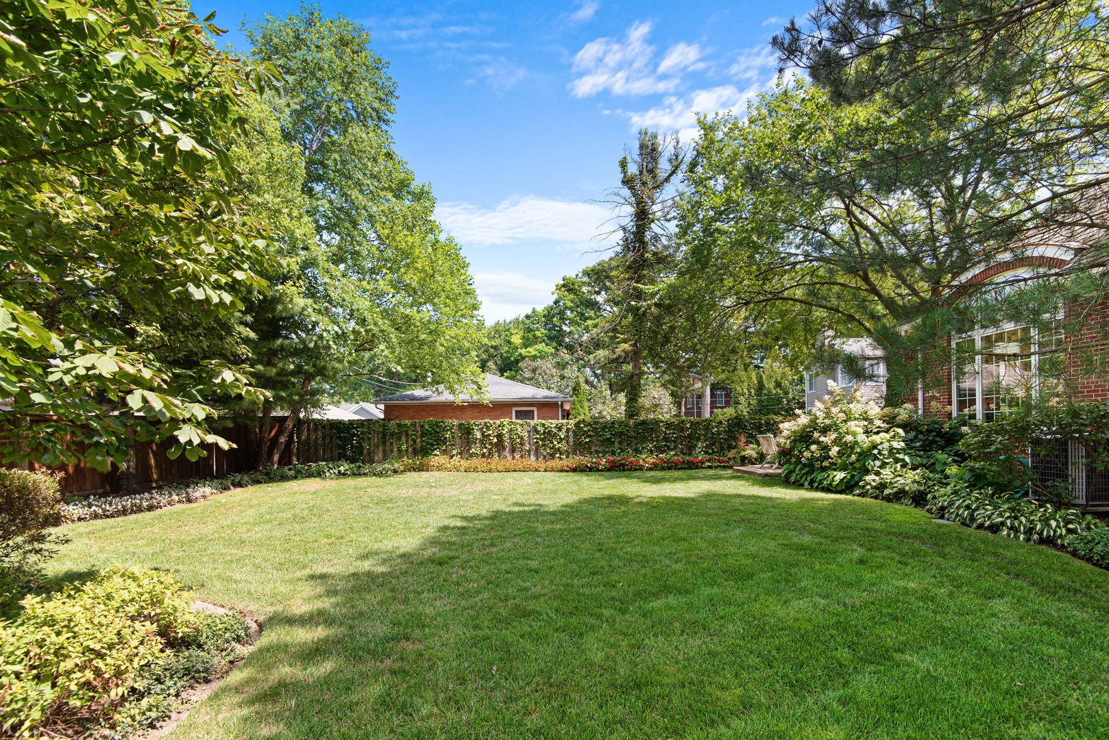 700 Harvard Street Wilmette, IL 60091 - Photo 46 of 50 a view of swimming pool with sitting area and garden